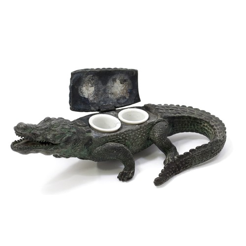 3205 - An early 20th century cold painted spelter novelty inkwell, cast as a alligator, hinged cover, 25cm ... 