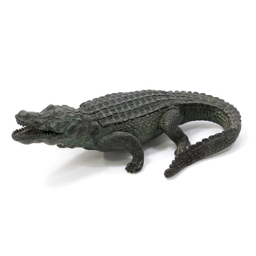 3205 - An early 20th century cold painted spelter novelty inkwell, cast as a alligator, hinged cover, 25cm ... 