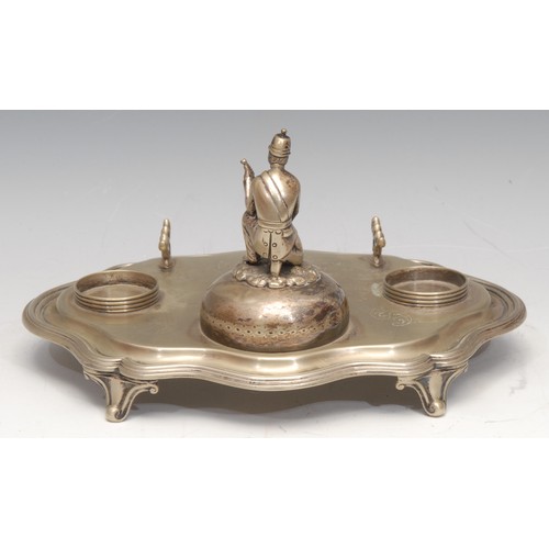 3314 - Military Interest - a late Victorian EPNS desk stand, surmounted by a figure of a soldier, 25cm wide