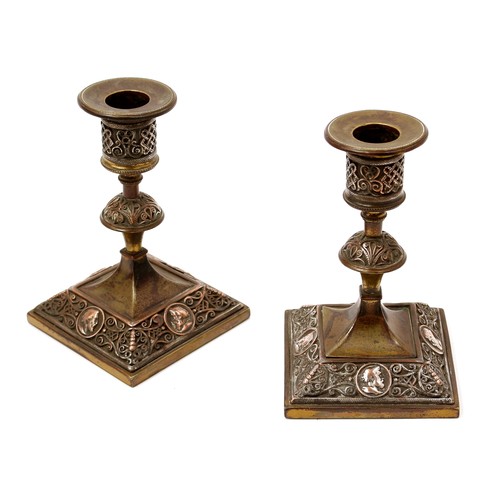 3150 - A pair of 19th century electrotype candlesticks, in the Renaissance Revival taste, applied with port... 