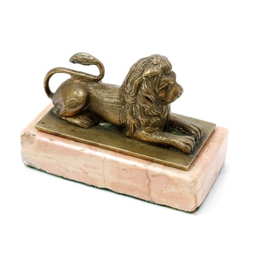 3206 - An early 20th century gilt cabinet bronze, of a recumbent lion, rectangular rose marble base, 9.5cm ... 