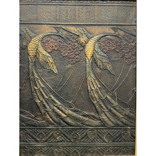 3298 - Interior Decoration - an Art Nouveau embossed panel, in relief with stylised peacocks, picked out in... 