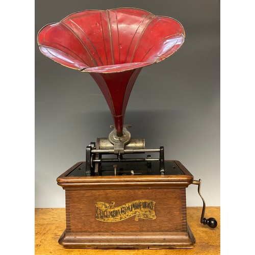 3371 - An early 20th century phonograph, The Columbia Gramophone, red painted tin horn, oak case, 31cm wide... 