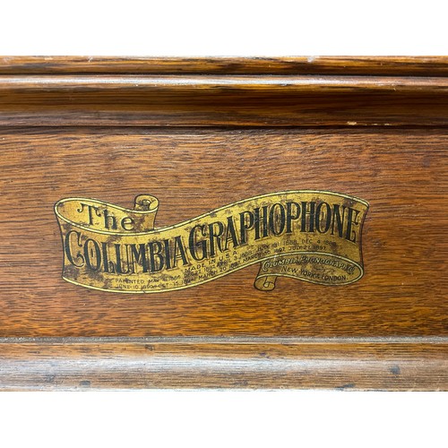 3371 - An early 20th century phonograph, The Columbia Gramophone, red painted tin horn, oak case, 31cm wide... 