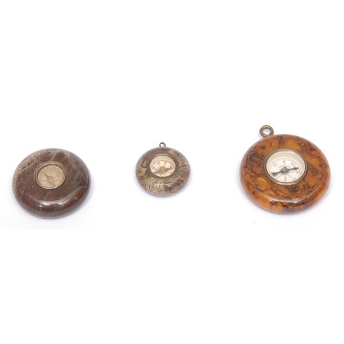 3248 - An early 20th century Cornish serpentine miniature compass, 3cm diam; another, similar, smaller; ano... 