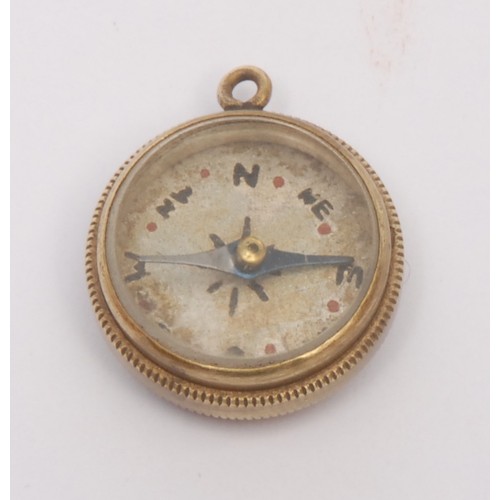 3249 - An early 20th century gilt metal compass watch fob, 2cm diam; another, Chinese (2)