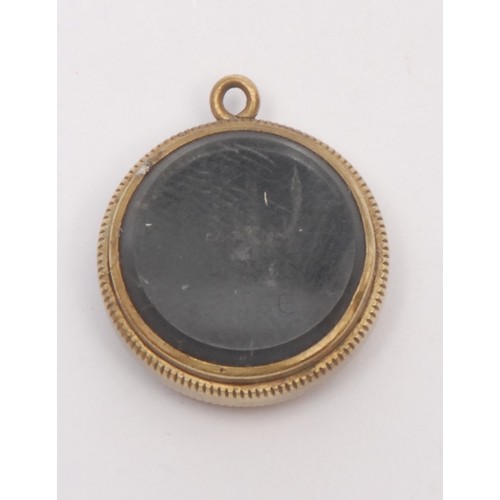 3249 - An early 20th century gilt metal compass watch fob, 2cm diam; another, Chinese (2)