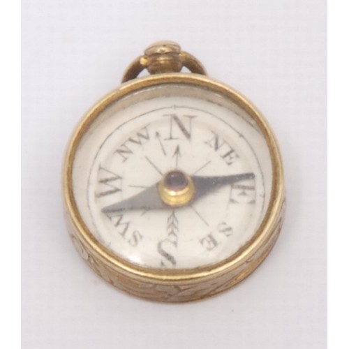 3246 - A 19th century gilt metal compass watch fob, of locket form, 2.5cm diam; another, miniature (2)