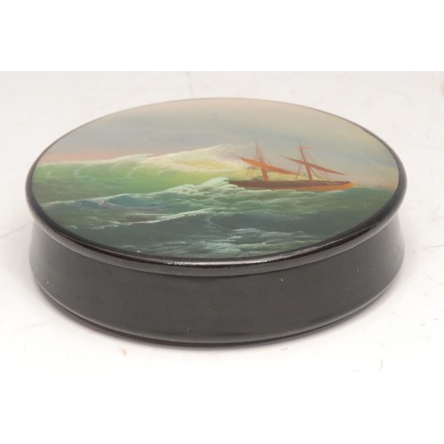 3166 - A Russian lacquer circular snuff box, the push-fitting cover painted with a ship on a stormy sea, 6c... 