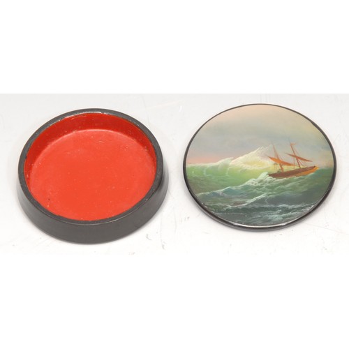 3166 - A Russian lacquer circular snuff box, the push-fitting cover painted with a ship on a stormy sea, 6c... 