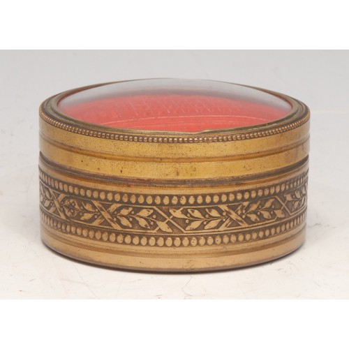 3088 - A Continental gilt metal circular snuff box, the push-fitting cover mounted with an intaglio impress... 