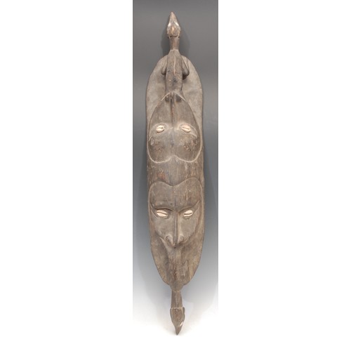 3438 - Tribal Art and the Eclectic Interior - a Papua New Guinea gope board or kwoi, carved in relief with ... 