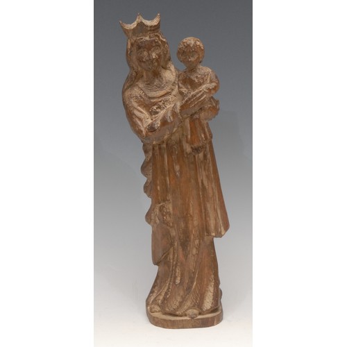 3090 - A Continental softwood carving, of the Madonna and Child, 31.5cm high