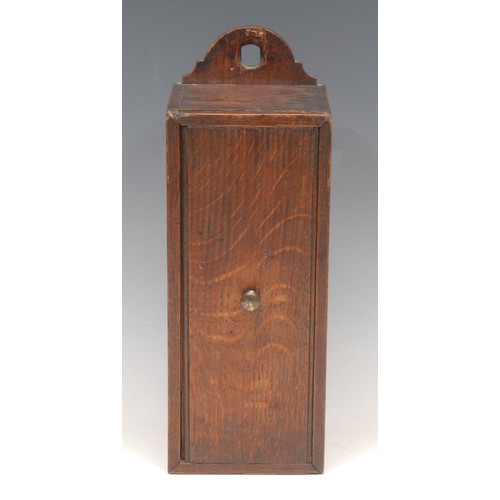 3102 - A George III oak candle box, arched cresting, sliding cover, 31cm high, c.1800