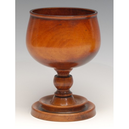 3352 - Treen - a turned goblet, 15cm high; another, lignum vitae, engine-turned central band, 11cm high (2)