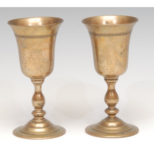 3152 - A pair of 19th century travelling pedestal cups or Communion chalices, each bell shaped bowl screw-t... 