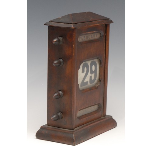 3124 - A large early 20th century perpetual desk calendar, sarcophagus cresting above glazed apertures for ... 