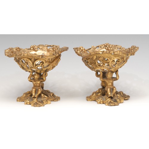 3151 - A pair of 19th century ormolu sculptural sweetmeat stands, cast in the Baroque taste with scantily c... 