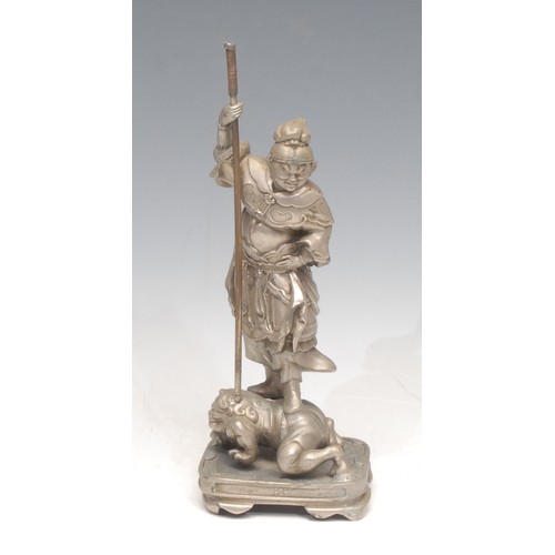 3120 - A Japanese paktong figure of a warrior, stood upon a surrendering frog dragon, rounded rectangular b... 