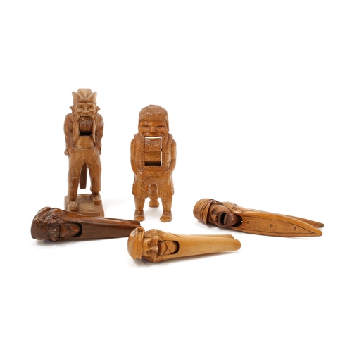 3533 - Nutcrackers - a Continental novelty lever-action nut cracker, carved as a bearded gentleman, he stan... 