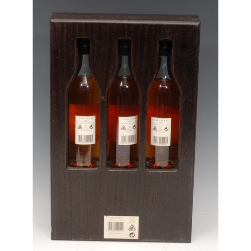 3415 - A presentation set of three 20cl bottles, Hine Grand Champagne Cognac, 1957, 1975 and 1981, wooden s... 