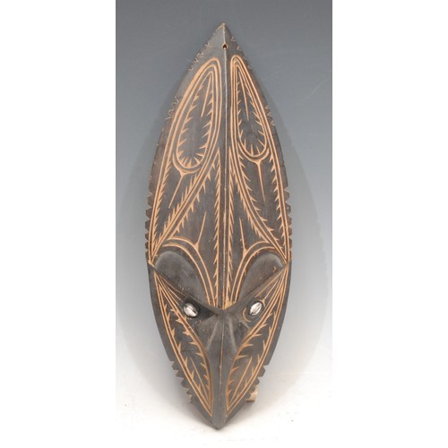 3439 - Tribal Art and the Eclectic Interior - a Papua New Guinea mask, carved with crocodile (pukpuk) image... 