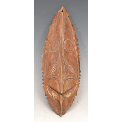 3439 - Tribal Art and the Eclectic Interior - a Papua New Guinea mask, carved with crocodile (pukpuk) image... 