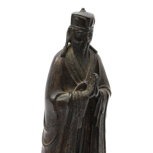 3245 - Chinese School (17th/18th century), a dark patinated bronze, of a Daoist Immortal, traces of gilding... 