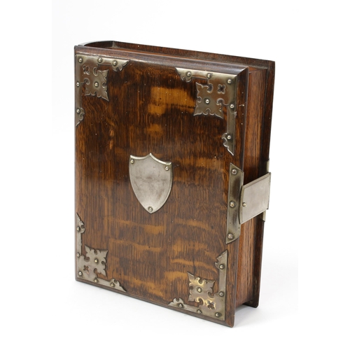 3136 - A late Victorian oak novelty tobacco cabinet, as a book, hinged cover enclosing lidded compartment a... 