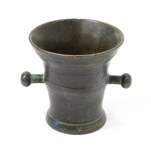 3185 - An 18th century bronze mortar, trunnion handles, 11cm high, maker's mark A struck twice, c.1750