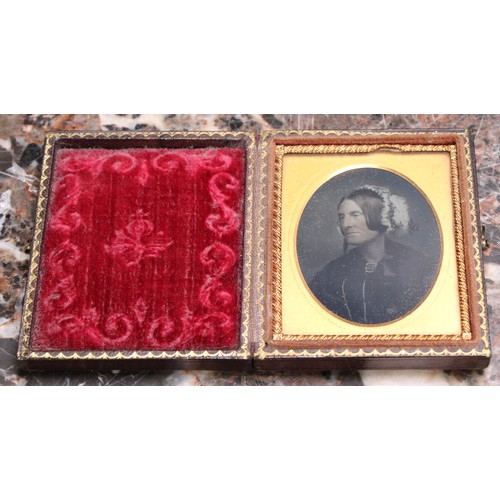 3612 - Photography - a 19th century ambrotype photograph, of a young lady holding a book, the union case mo... 