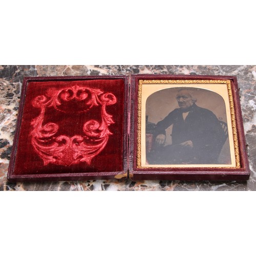 3612 - Photography - a 19th century ambrotype photograph, of a young lady holding a book, the union case mo... 