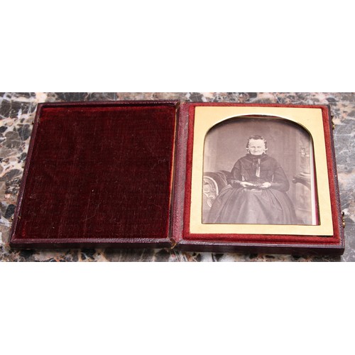 3612 - Photography - a 19th century ambrotype photograph, of a young lady holding a book, the union case mo... 