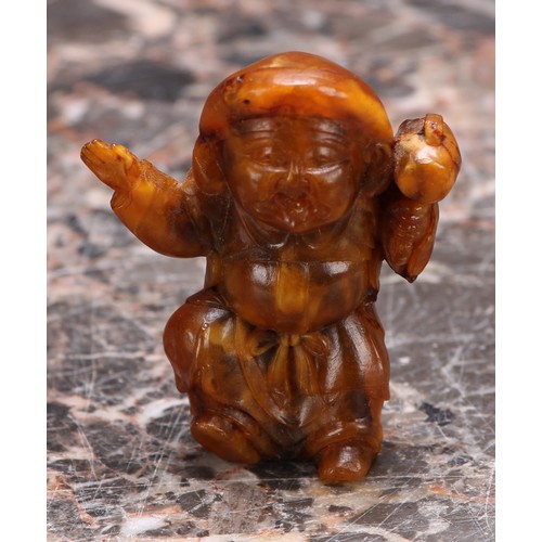 3113 - A Japanese amber netsuke, carved as a young boy, 5cm long