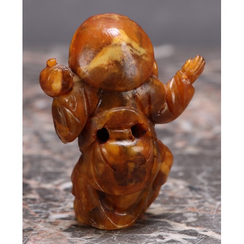 3113 - A Japanese amber netsuke, carved as a young boy, 5cm long