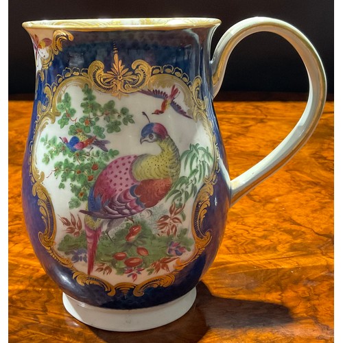 64 - A large Worcester bell shaped mug, painted with fanciful birds within gilt cartouches, the scale blu... 