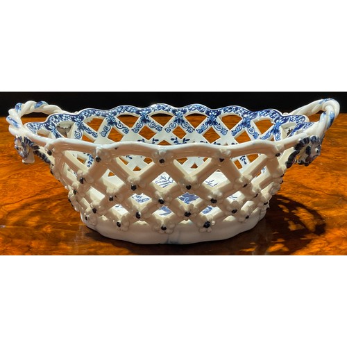 65 - An Lowestoft two-handled oval basket, central oval reserve painted in underglaze blue with flowers, ... 