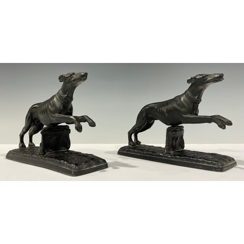 102 - A pair of spelter greyhound or whippet table decorations, 12cm high, 16.5cm long (2)