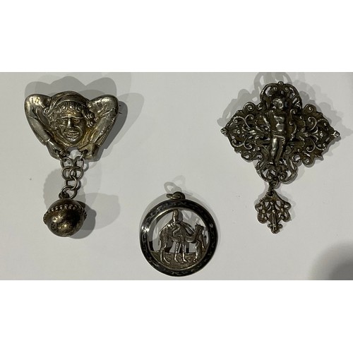 114 - Boxes & Objects - a novelty Victorian silver coloured metal jester brooch; another brooch, a putto, ... 