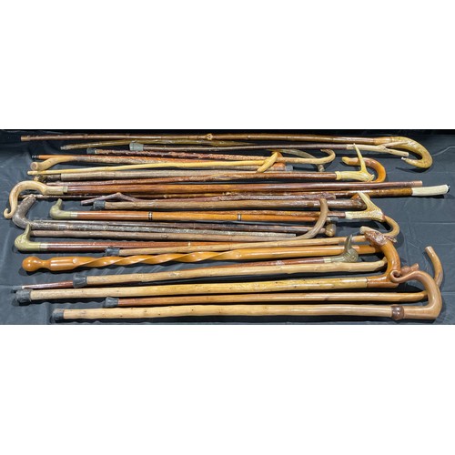 131 - A collection of walking sticks and fell walking sticks, various sizes, including antler and horn han... 