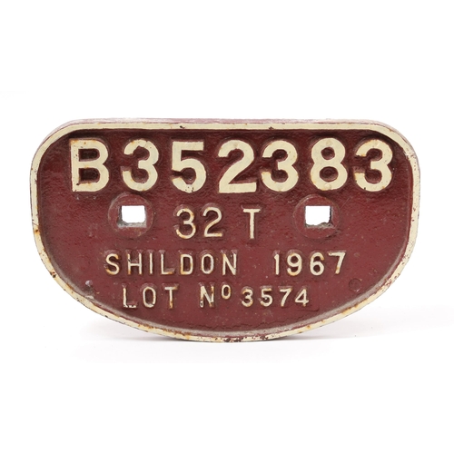 7275 - Railwayana - a 'D' shaped painted cast iron wagon plate, raised white lettering on a red/maroon grou... 