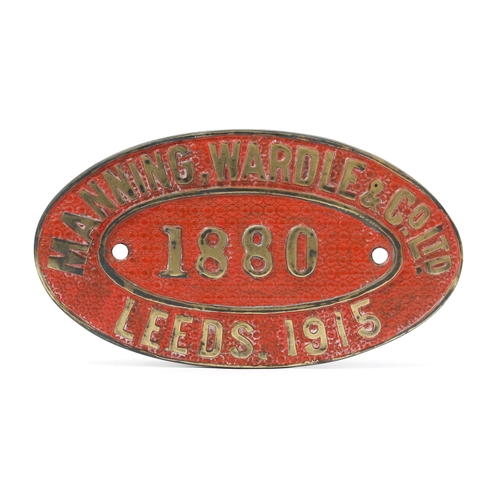 7282 - Railwayana - an oval shaped painted cast brass works plate, raised lettering on a red ground, 'MANNI... 