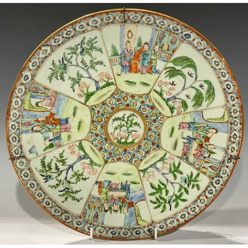 144 - Ceramics - a Chinese circular charger, painted in the famille verte palette with central flycatcher ... 