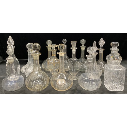 158 - Glassware - a collection of cut glass decanters, various shapes, some with associated stopper, early... 