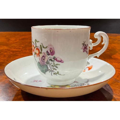 226 - A Meissen coffee cup and saucer, painted with floral bouquets and scattered flowers, brown line rims... 