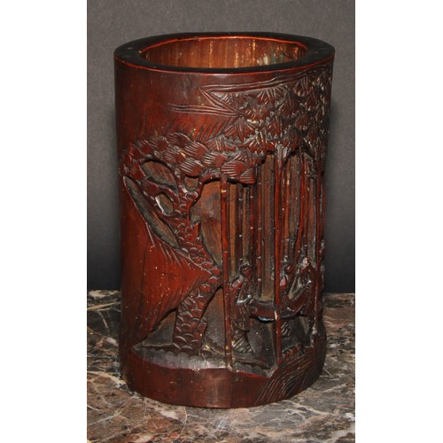 232 - A pair of Chinese bamboo bitong brush pots, carved with figures amongst trees, 18.5cm high, early 20... 