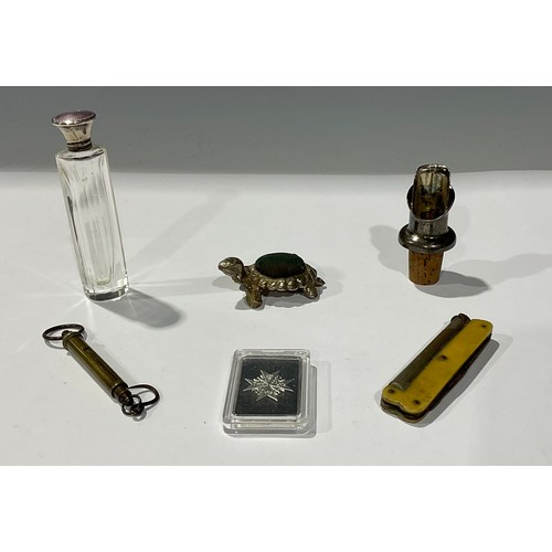 241 - An enamel and silver topped scent bottle; a tortoise pin cushion; miniature scales; a pipe smokers p... 