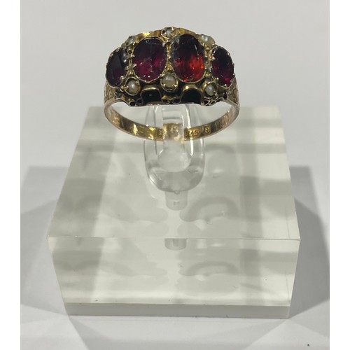 285 - A 19th century 9ct gold ring set with an arrangement of garnet and seed pearls, size O, marked 375, ... 