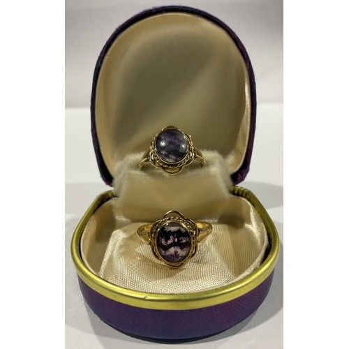 290 - A 9ct gold mounted Derbyshire Blue John ring, single oval polished cabochon, size R, marked 375, She... 