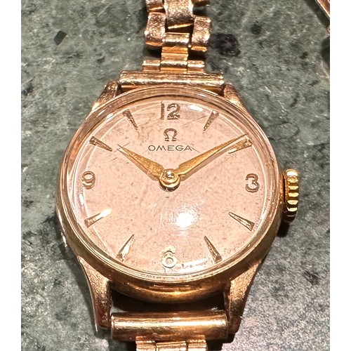 301 - A lady's Omega 9ct gold watch, Champagne dial, baton indicators, marked 375, integral 9ct gold fancy... 